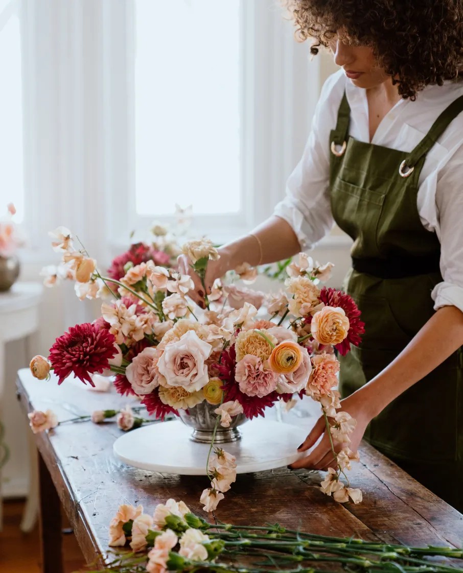 woman arranging flowers 