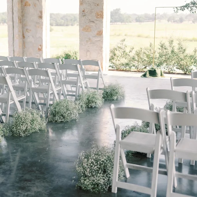 Captivate guests as they enter the celebration with a floral ceremony aisle.