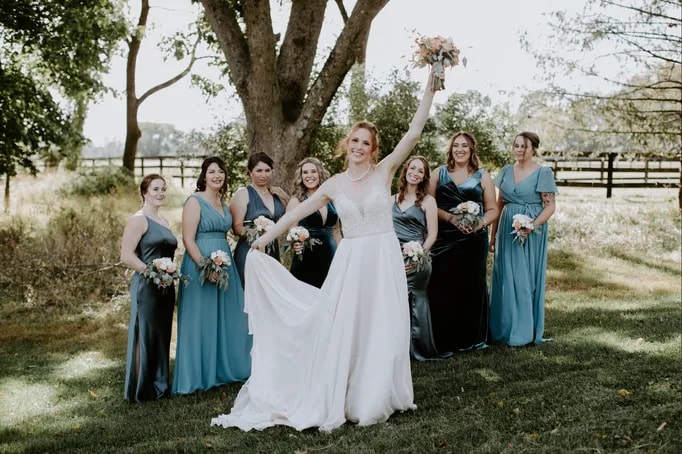  Bride holding her vibrant, freshly arranged bridal bouquet