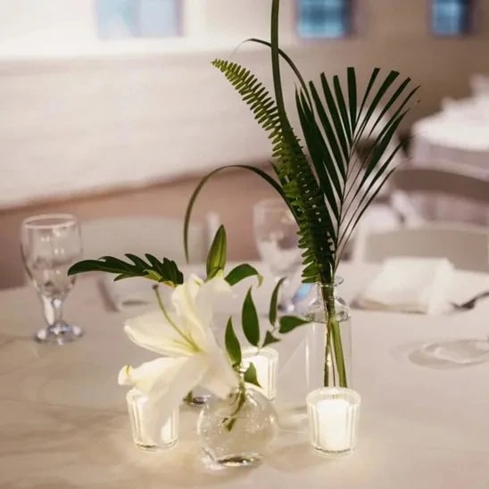 Lush green foliage in a bud vase