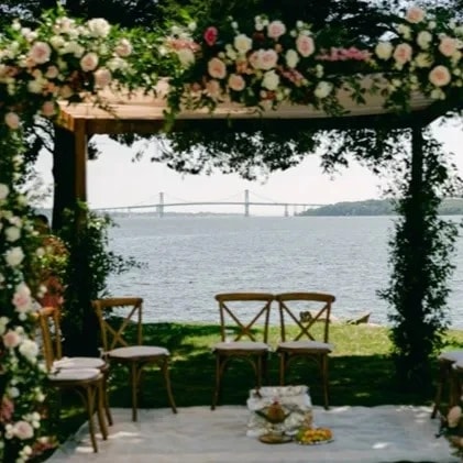 A beautiful floral wedding arch designed by Poppy Flowers