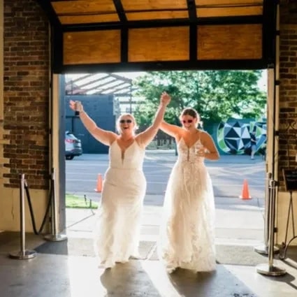 Two brides smiling 